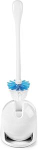 White OXO compact toilet brush with automatic canister, showing the brush slightly lifted and the canister door open.