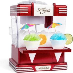 Nostalgia red tabletop snow cone maker with stainless steel blades, reusable cups, and vintage design.