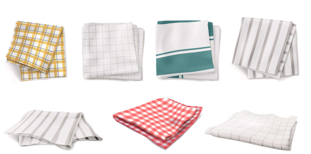 Top-rated kitchen towels for 2025 displayed on a modern countertop, showing various colors and textures for cleaning and drying dishes.