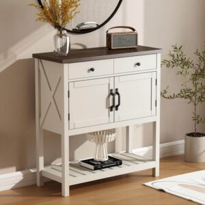 A charming ChooChoo farmhouse console table with a rustic light wood top, soft white body, and black handles, featuring a large drawer, two-door cabinet, and a slatted bottom shelf, with X-shaped side designs.